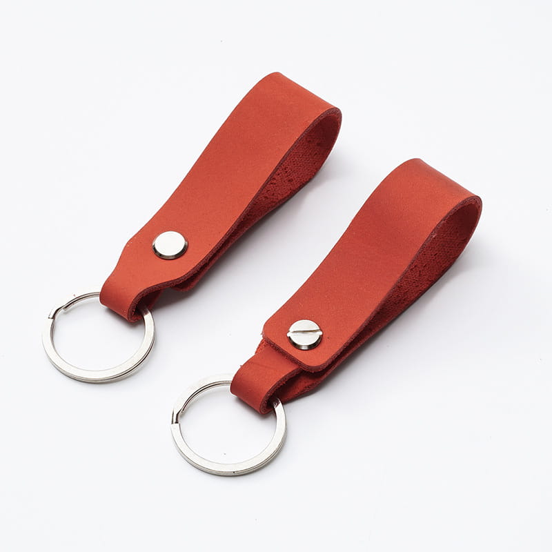Two reddish-brown leather car keychains with silver-toned metal rings and rivets in a genuine lanyard key holder set.