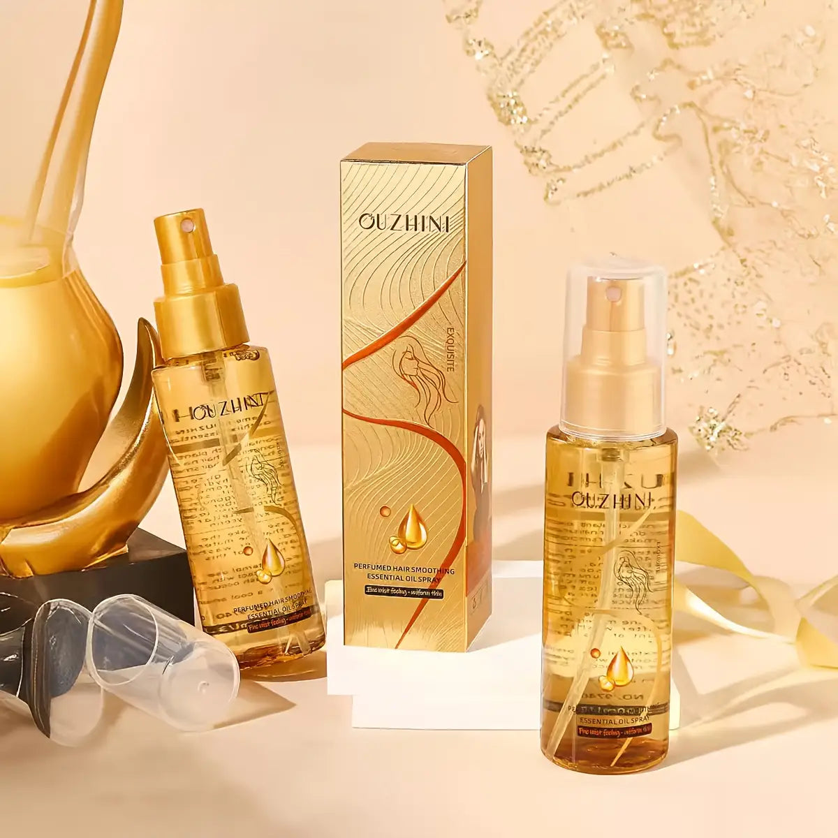 spray esencial de aceite para el cuidado del cabello dorado ouzhini en una botella transparente y elegante, con bomba de tono dorado diseñada para alisar, cuidar y perfumar el cabello como aceite esencial para el cuidado, en formato de 100 ml.
