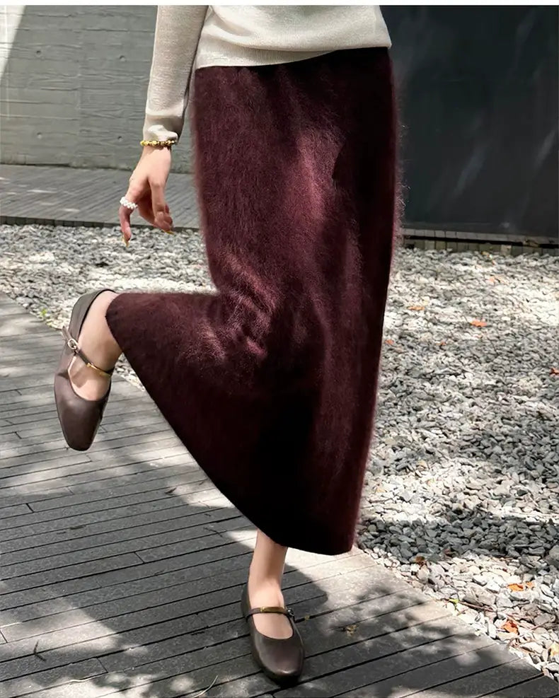 A plush deep burgundy fuzzy mohair wool a-line maxi skirt with a soft textured surface and flowing silhouette.