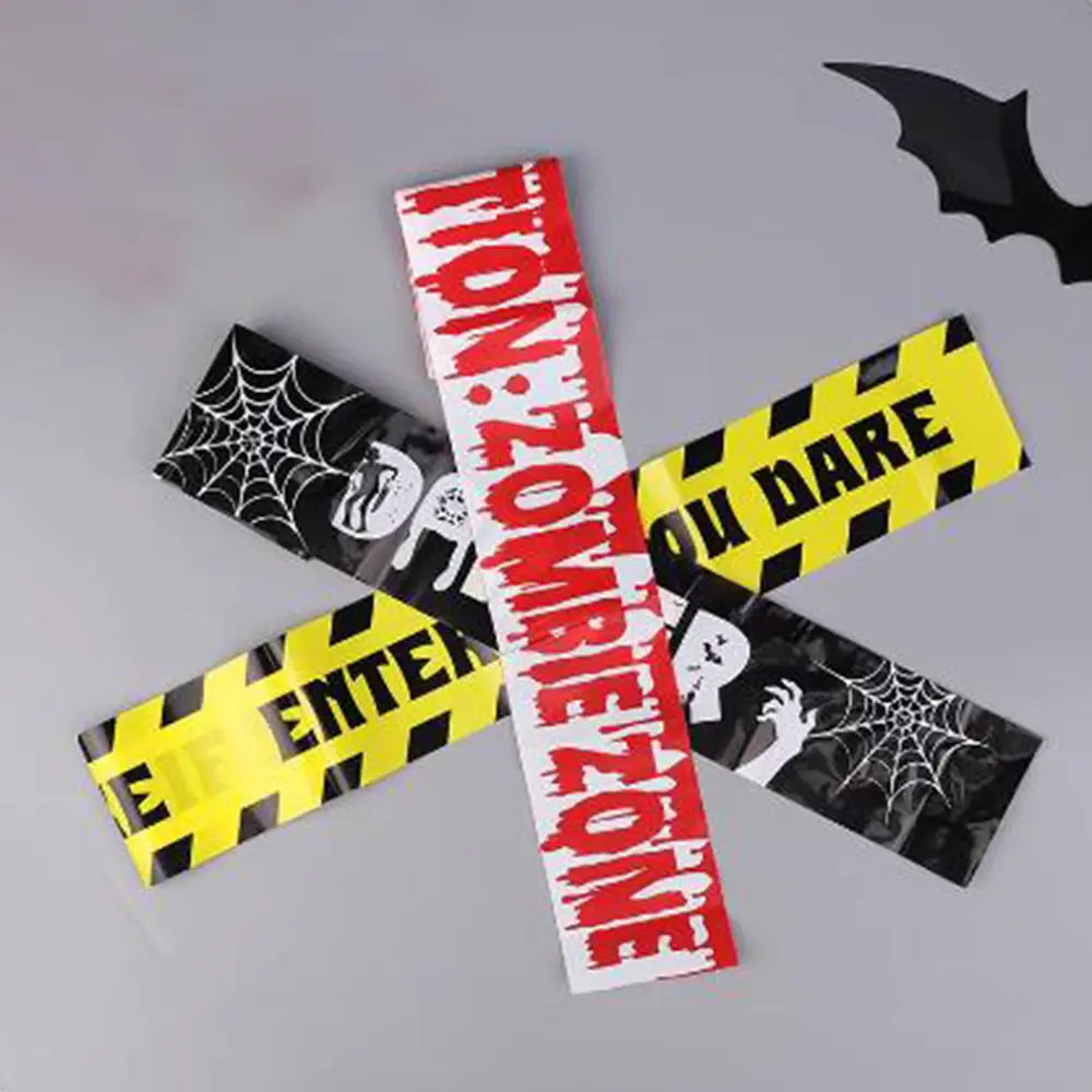 halloween caution tape plastic wristbands in black yellow and red featuring zombie and spiderweb designs for spooky party warning tape use