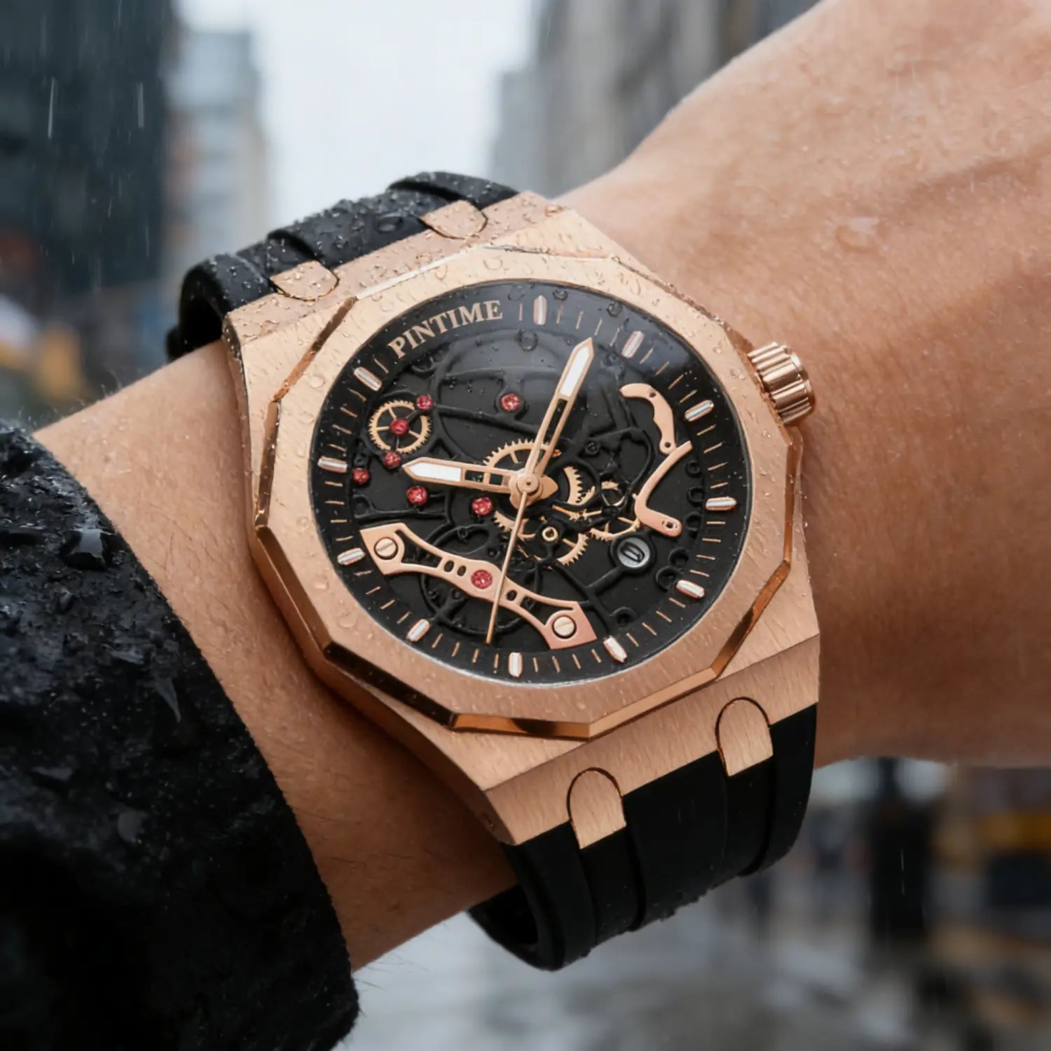 Rose gold pintime men luxury skeleton quartz watch with black dial, red accent jewels, and black rubber strap.