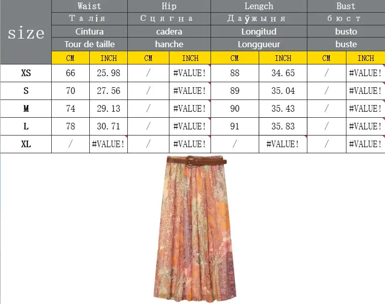 Jupe midi taille haute à imprimé cachemire, présentant un motif floral chatoyant pêche et or à plusieurs tons, rehaussé d’une ceinture marron.