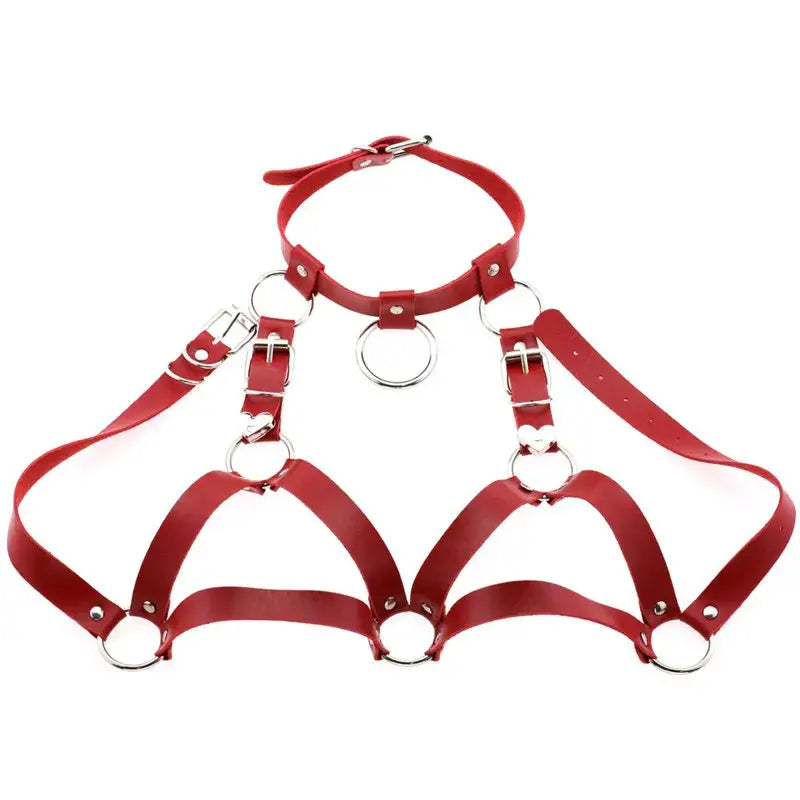 Red leather goth body harness featuring silver metal rings and buckles designed as faux leather body jewelry for black goth body looks.
