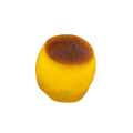 A front view of a golden-yellow translucent caramel pudding stress ball with a glossy brown top for stress relief