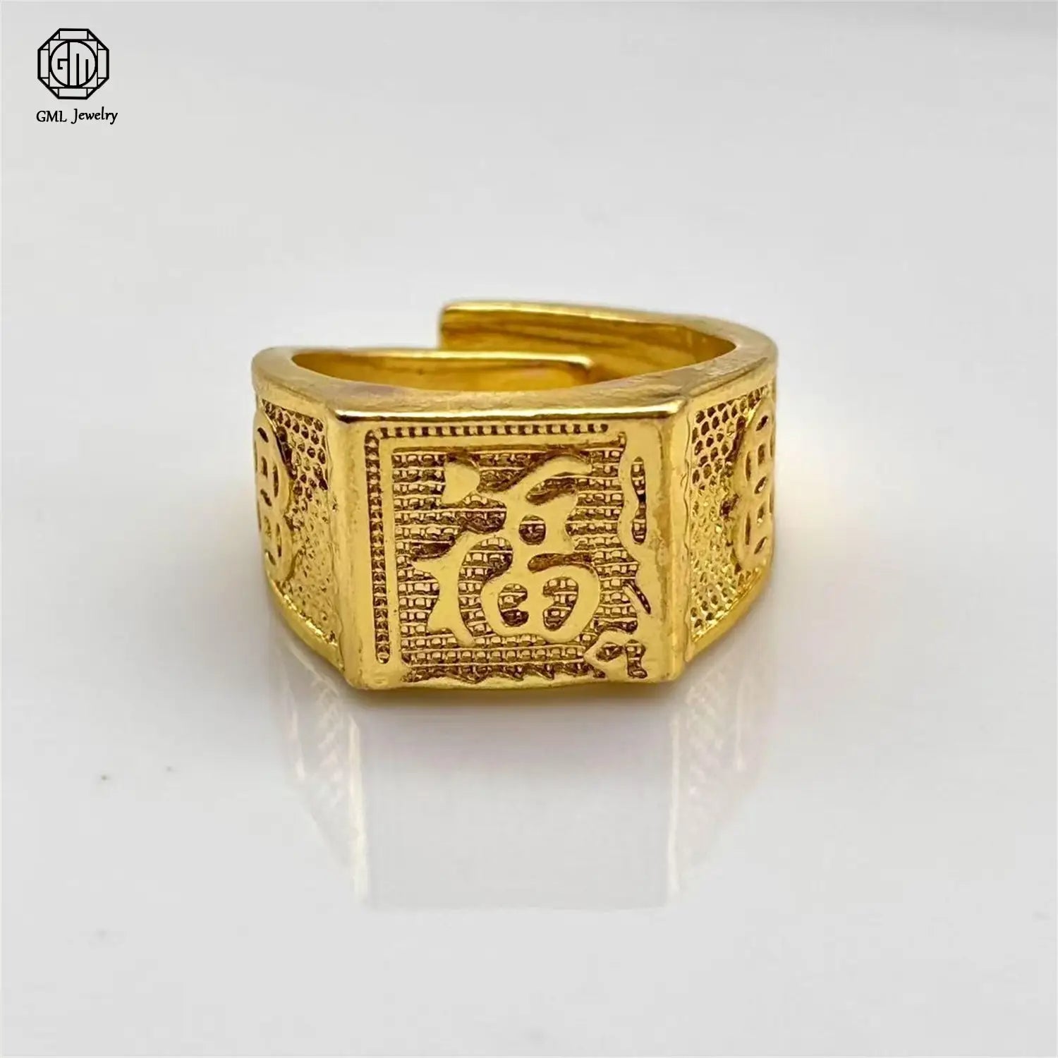 Sand gold adjustable gold ring featuring a fade resistant, gold-colored rectangular band with intricate engraved patterns and a hinged design.
