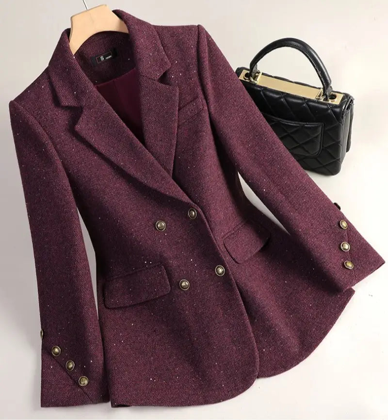 A textured maroon wool blend double breasted blazer with gold toned buttons.
