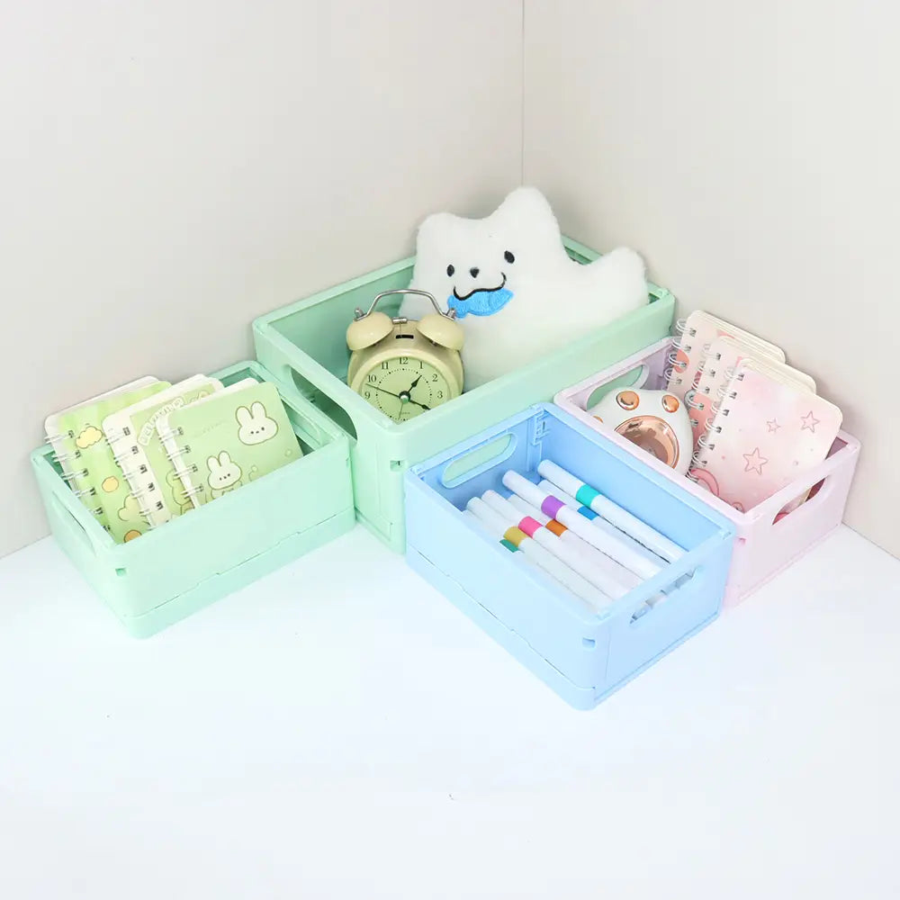 pastellfarbene faltbare Aufbewahrungsboxen aus Kunststoff mit Griffen und offenen Oberseiten, ausgelegt als Desktop-Organizer für eine effiziente Nutzung von Aufbewahrungsboxen-Körben.