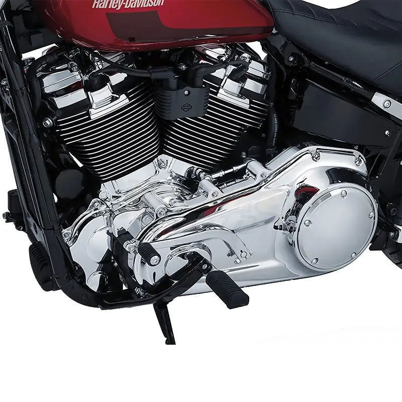 Chrome inner primary accent cover for Harley touring 17-22 featuring a shiny chrome engine with black accents and a red fuel tank displaying the Harley-Davidson logo.
