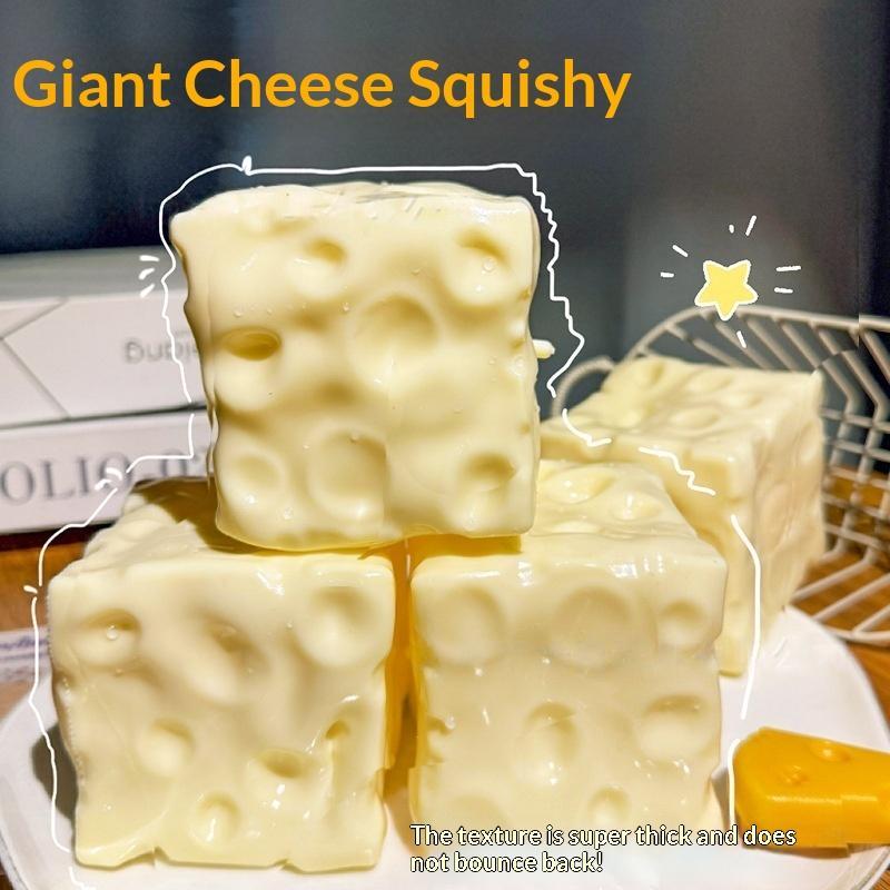 Cream-colored, square-shaped cheese-themed fidget toy measuring 6cm x 6cm with a soft, bouncy texture and characteristic holes designed for stress relief.