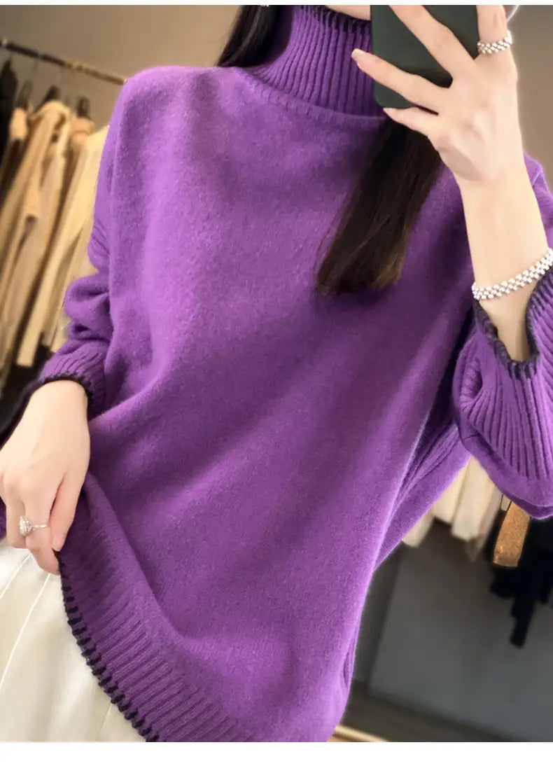 A soft vibrant purple pure wool turtleneck sweater for women with ribbed cuffs and hem.
