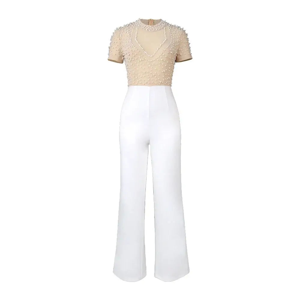 Beige beaded short-sleeved top paired with high-waisted white wide-leg trousers in an elegant party outfit.