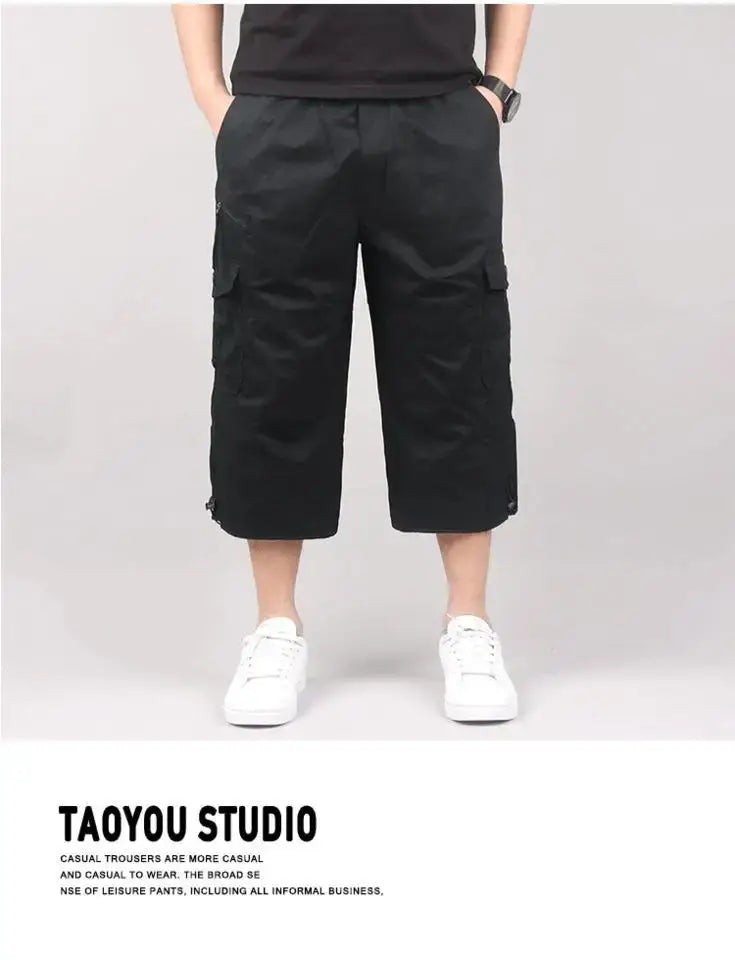 Bermudas cargo pour hommes, décontractés pour l’été, à poches multiples, en coton, en noir, avec plusieurs poches latérales et une coupe décontractée.