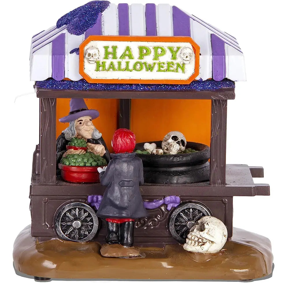 Décoration Halloween en pot à soupe roulant miniature avec auvent rayé violet et blanc, chariot de marché, présentant une vendeuse sorcière avec des crânes et des citrouilles mesurant 5 x 14 cm