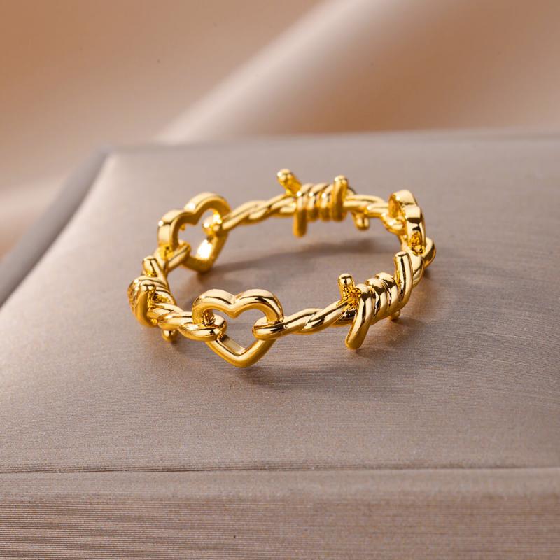 Gold color stainless steel ring for women featuring a twisted wire design with heart-shaped cutouts and barbed wire accents vintage wedding jewelry.