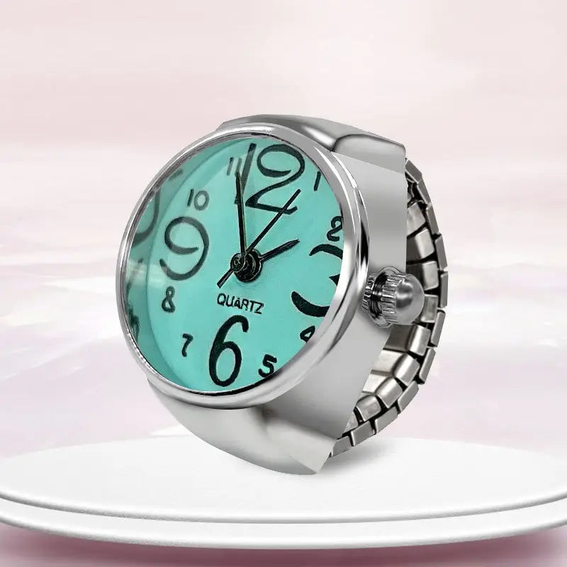 Silver-toned adjustable ring watch quartz finger couple jewelry with a turquoise face and black arabic numerals.