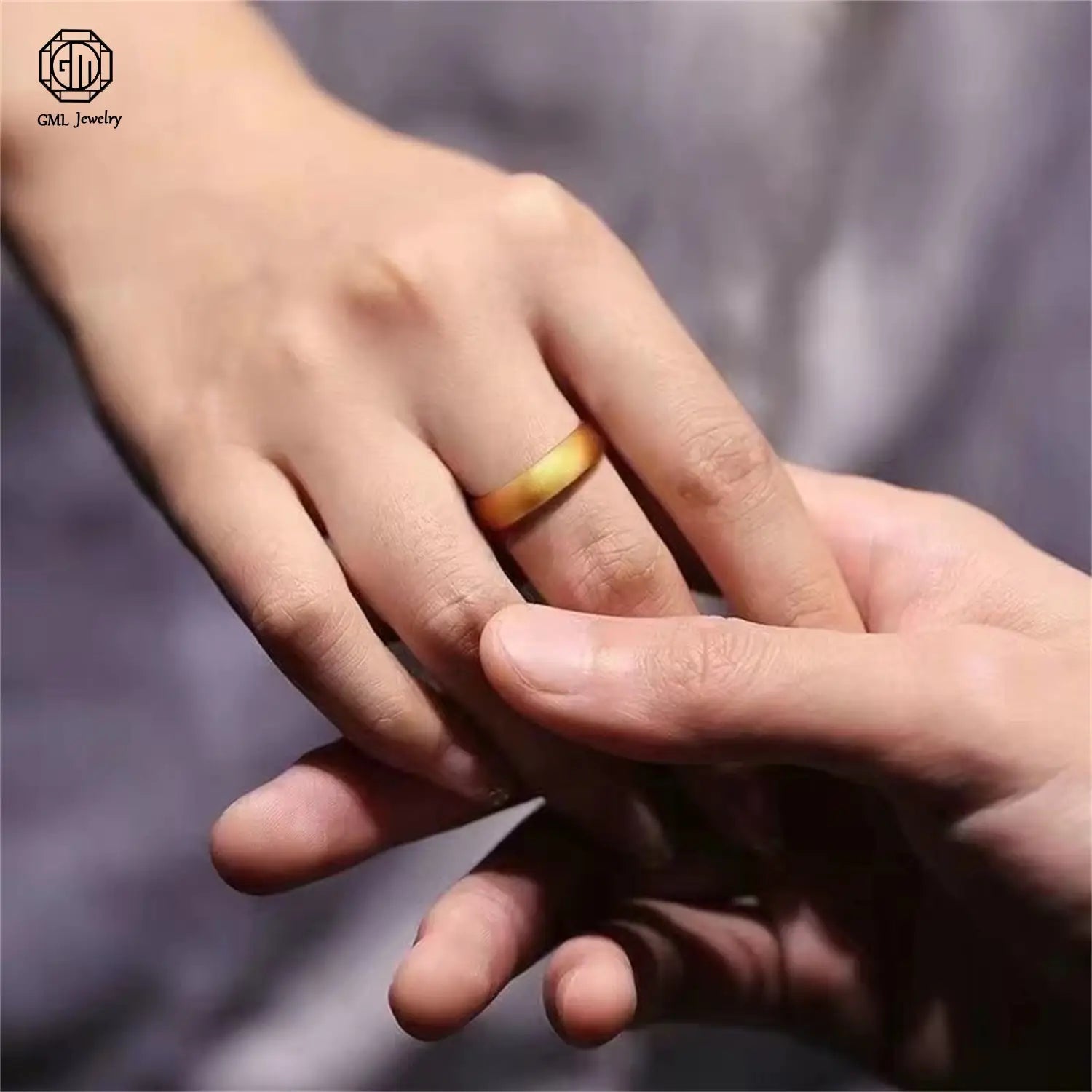 A sleek sand gold adjustable gold ring featuring a fade resistant solid gold wide band with a smooth slightly tapered design suitable for unisex wear.
