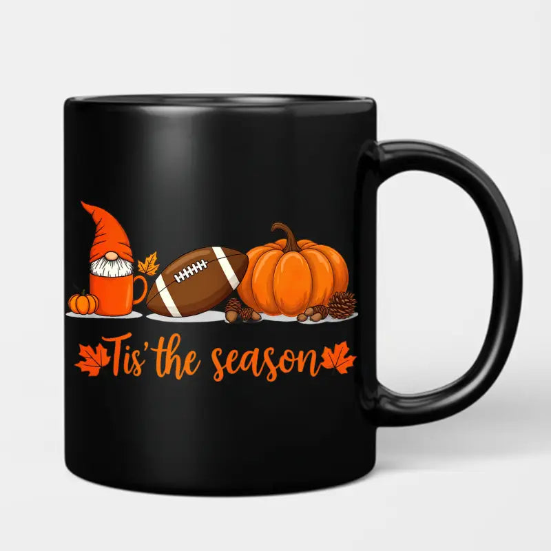 Black ceramic Easter egg coffee mug featuring a festive orange gnome illustration with a football and pumpkin and the phrase tis the season in orange script.