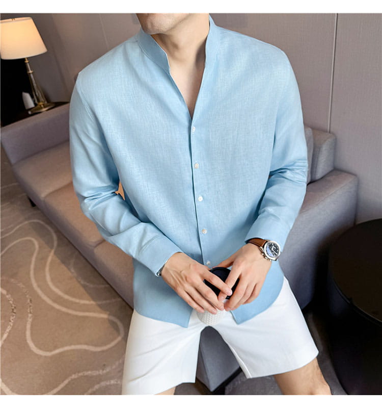 Light blue men’s linen long-sleeved button-up shirt with mandarin collar and subtle texture.