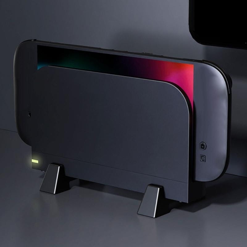 Black Nintendo Switch console with a sleek matte finish and vibrant RGB lighting along the top edge on an ABS gaming support bracket console dock stand.