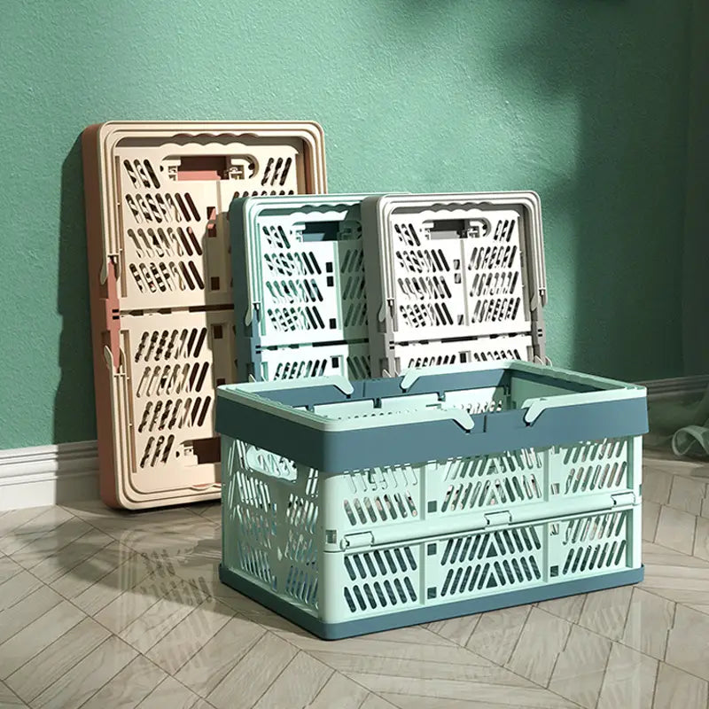 A mint green and gray foldable plastic storage basket with a sturdy ventilated design suitable for collapsible crate use.