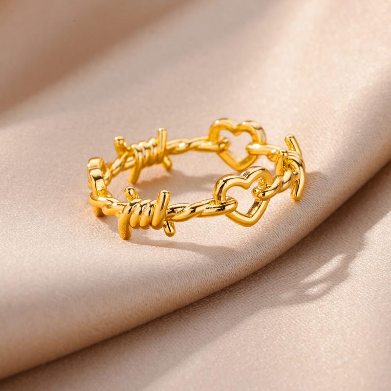 stainless steel gold color ring for women featuring a vintage chain design with heart-shaped links and barbed wire accents ideal for wedding jewelry
