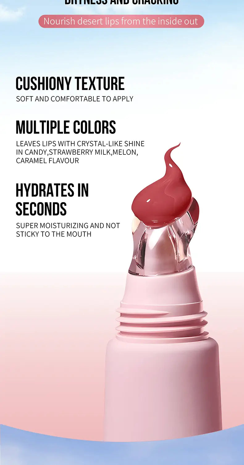 Pink cylindrical hydrating fruit flavored glossy lip balm tube with a clear crystal-like cap and a dollop of red product on top.