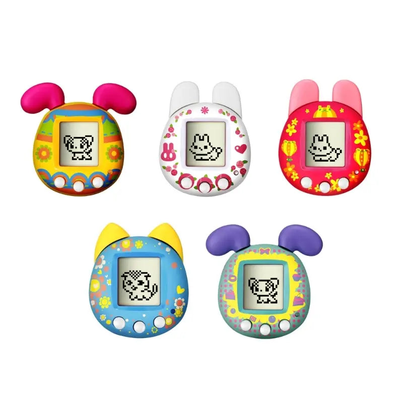 colorful rounded virtual pet game handheld electronic toys with soft plastic bodies and cute animal ear attachments in pink white red blue and purple designed as electronic pets.
