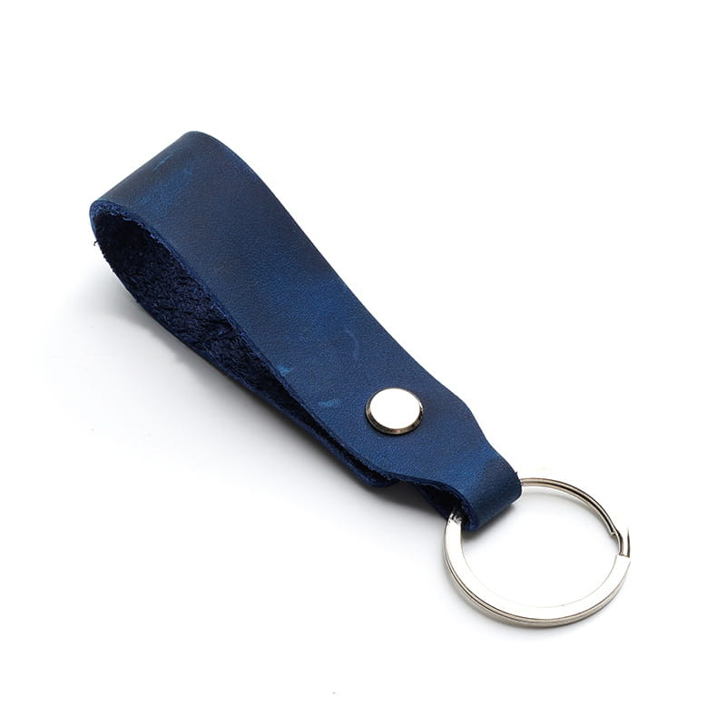 Dark blue leather car keychain with a silver-toned metal ring and button as part of a genuine leather lanyard key holder set.