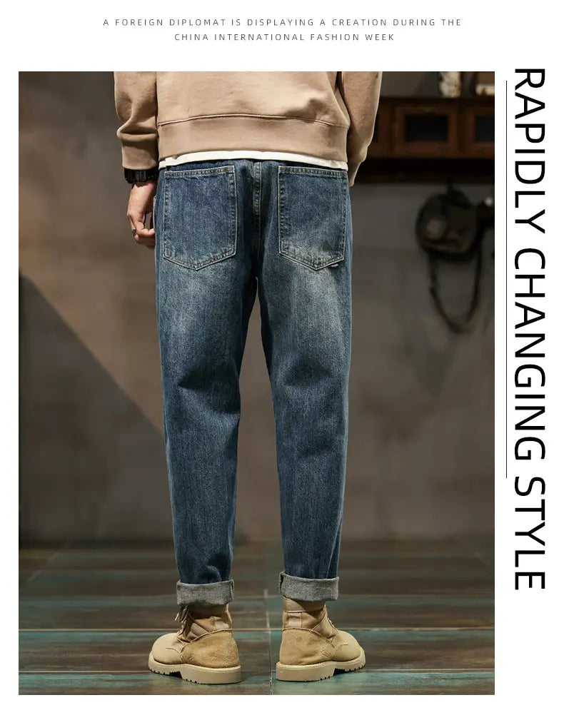 Men loose denim harem jeans in blue with rolled cuffs and a classic five-pocket design.