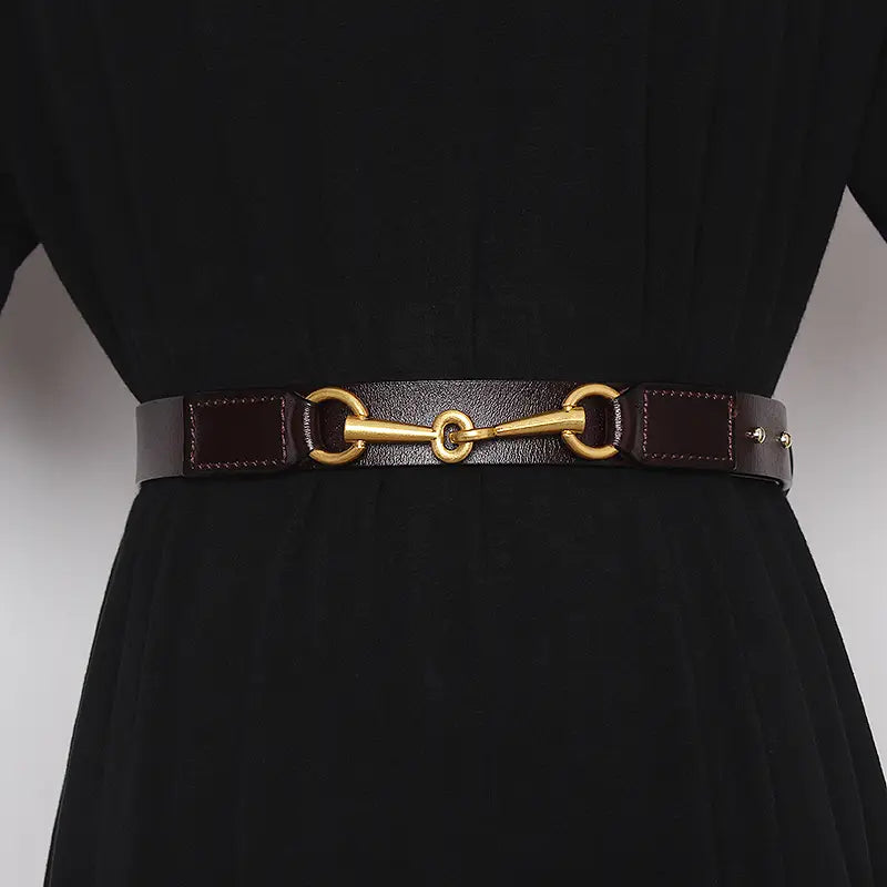 Dark brown leather women belt with a prominent gold-tone horsebit buckle.