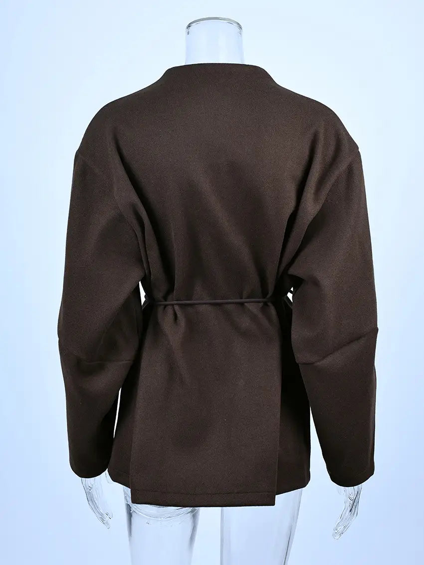 Brown wool long sleeved coat with a tied waistband suitable for winter wear.