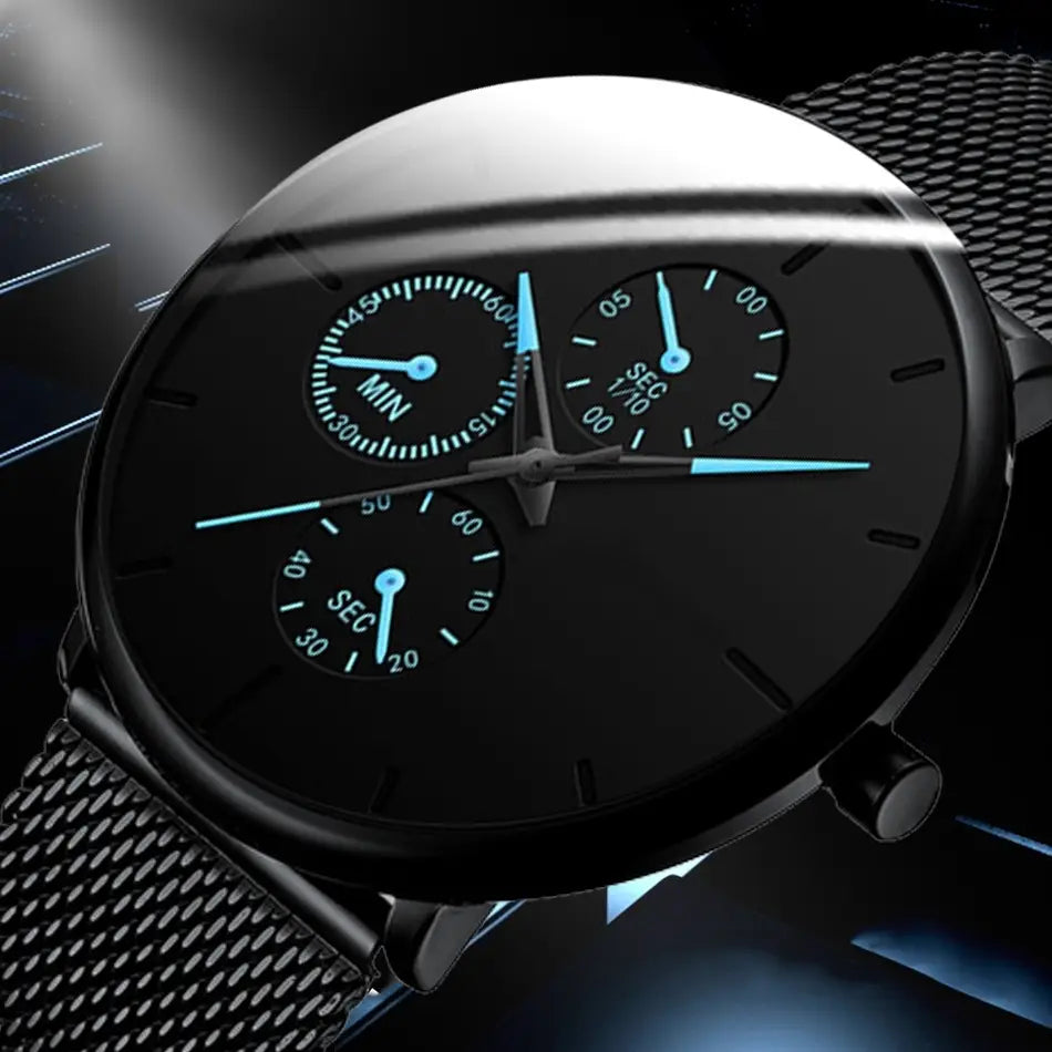 Montre à quartz à maille noire ultrafine pour hommes, avec un cadran chronographe et des aiguilles bleu lumineux, ainsi qu’une sangle en maille.