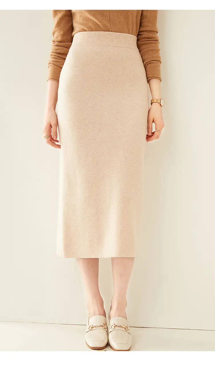 Beige high-waisted wool knit midi skirt in a smooth slightly textured fabric perfect for formal and casual wear.
