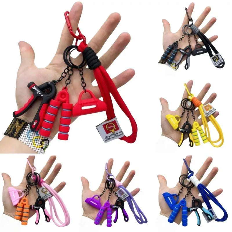 A colorful fitness keychain mini gym equipment bag pendant featuring multi-functional miniature hand grips and resistance bands in vibrant red, yellow, pink, purple, blue, and black.