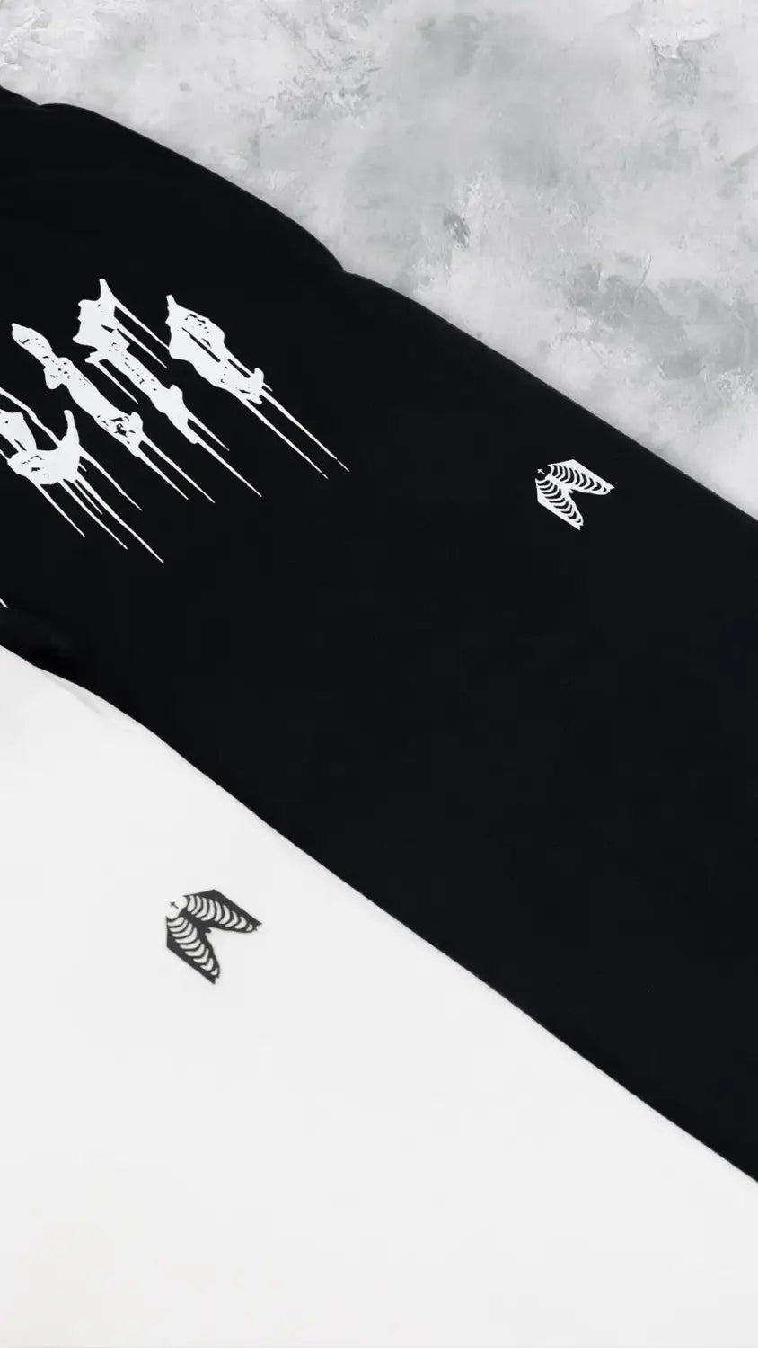 Survêtements d’entraînement pour hommes noirs, avec des motifs de dague squelettique blanche et d’ailes, adaptés aux vêtements d’entraînement.