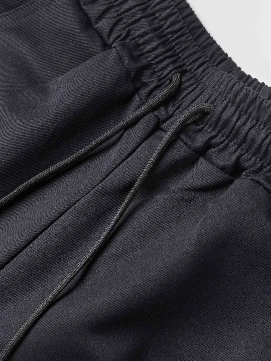 Herren schwarze Multi-Taschen-Cargohosen, lässige Jogginghosen, mit einem weichen, strukturierten Stoff sowie Kordelzug- und elastischem Bund.