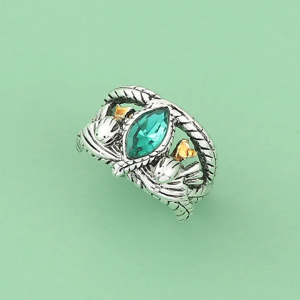 silver ring with an intricate twisted design featuring a central teal gemstone and small gold accents for lord ring of barahir green crystal cosplay ring.