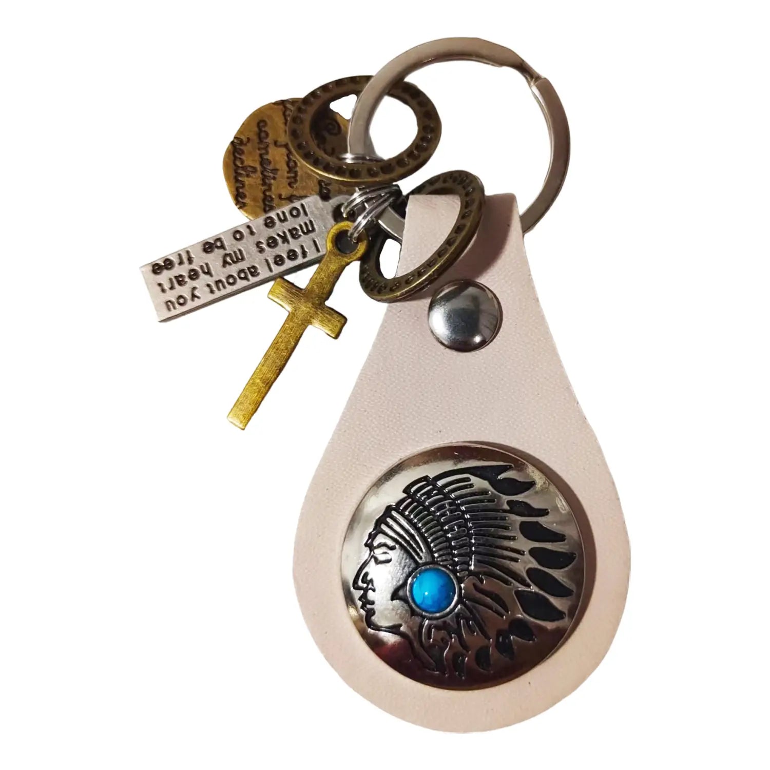 A cream-colored leather turquoise star keychain charm featuring a silver-toned Native American chief medallion with turquoise stone inlay and attached gold cross, engraved metal tag, and circular metallic rings.