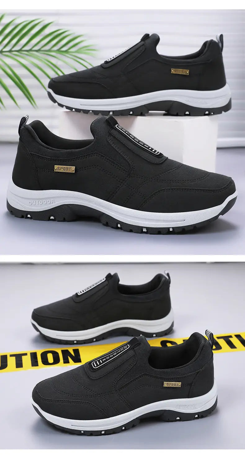 men orthopedic slip-on walking shoes in black with white soles and gold-tone branding patches designed for comfort and support.