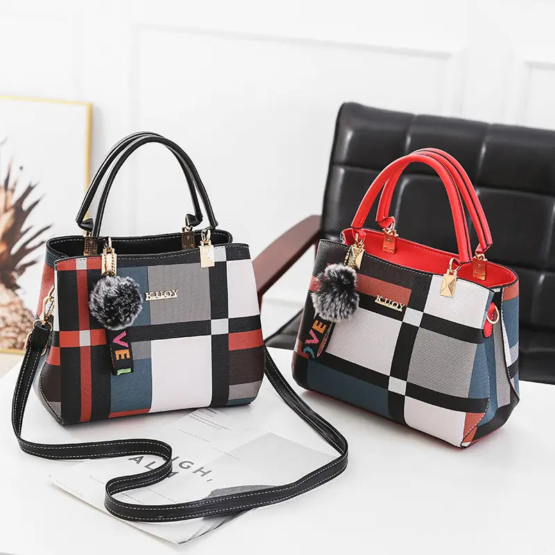 plaid-patterned black crossbody handbag pu leather satchel style1 style2 with black red white and gray checkered design and faux fur pom-poms on the handles