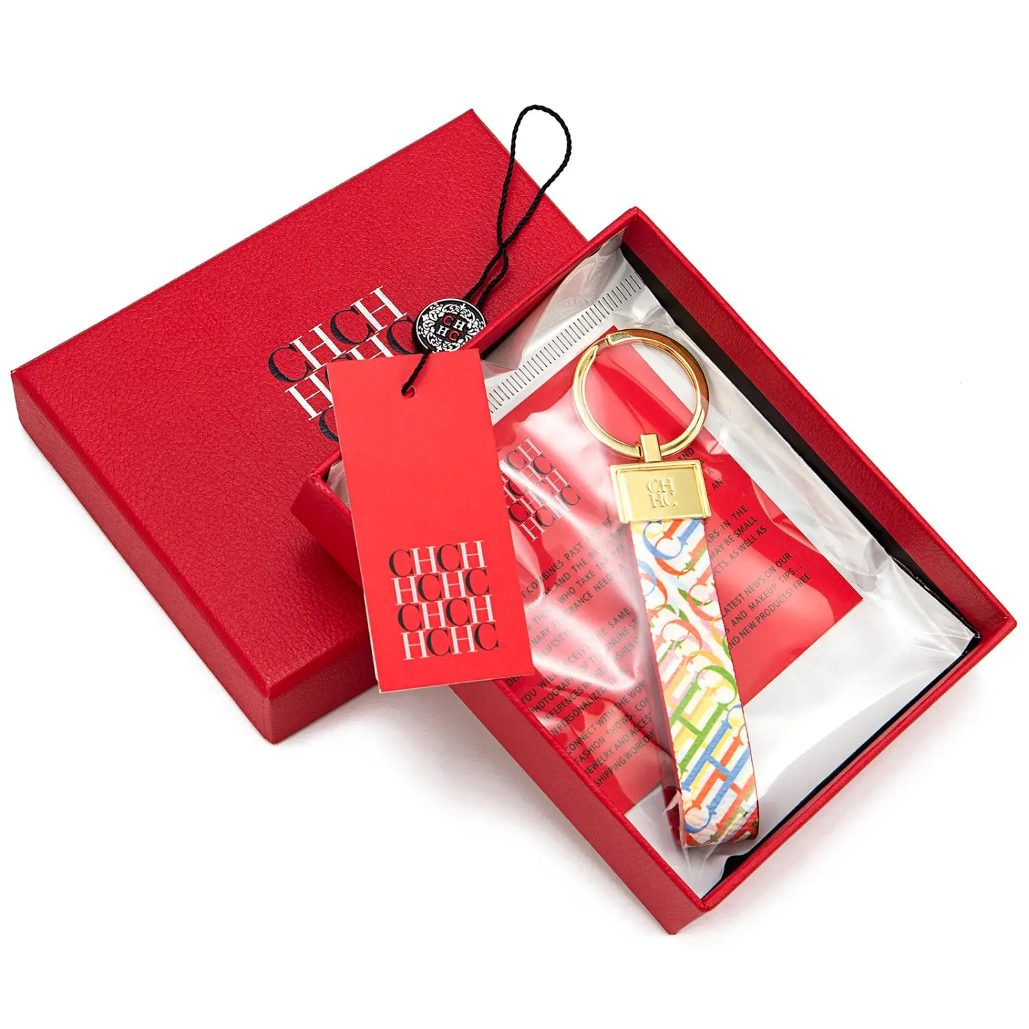 A colorful patterned leather logo keychain with a gold-tone metal ring and rectangular plaque designed as a fashionable accessory and gift.