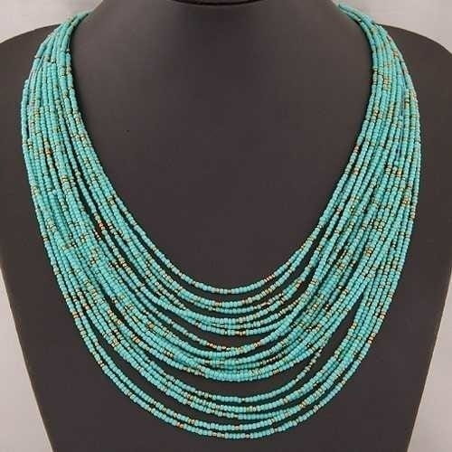 Boho multi-layer bead statement necklace featuring a multi-strand turquoise beaded design with subtle metallic accents.