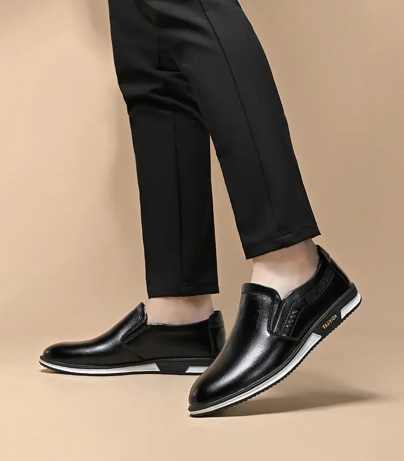 Men leather slip on driving shoes casual loafers in black leather with a white rubber sole and subtle textured detailing on the side.