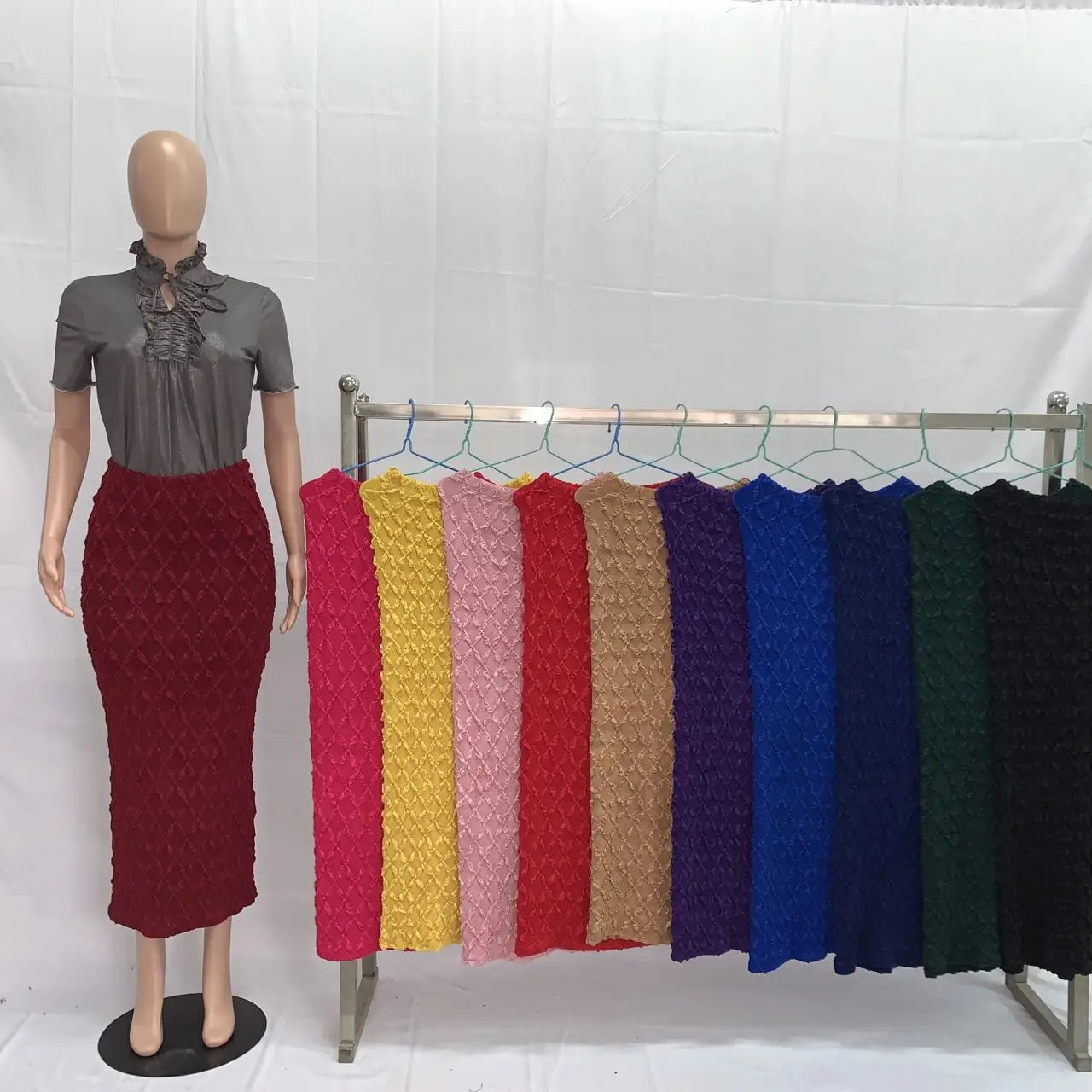 red textured knit midi skirt high waist slim fit displayed on a mannequin