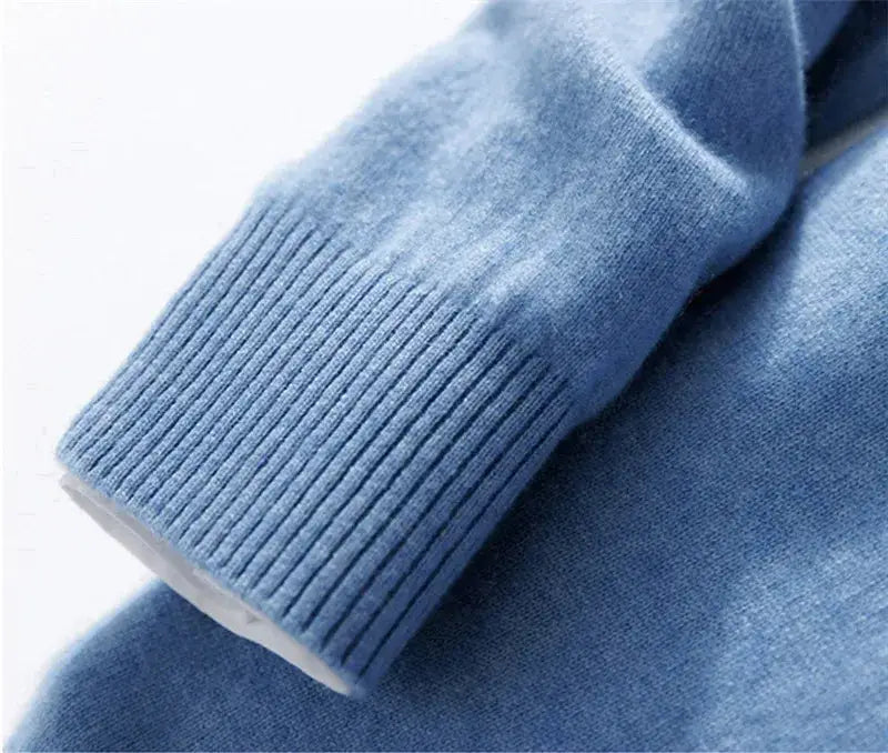 Soft light blue ribbed knit cuff with subtle white inner lining on men cashmere v neck pullover sweater.