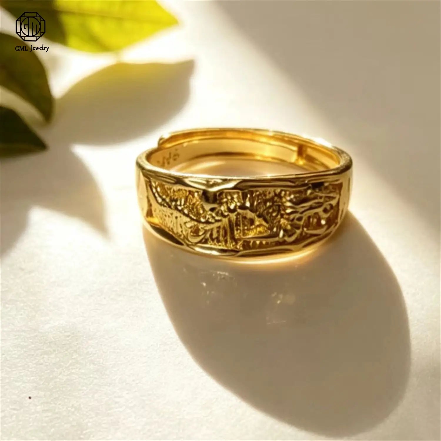 Sand gold adjustable gold band ring with intricate engraved islamic calligraphy and decorative patterns featuring a fade resistant matte finish for unisex wear.