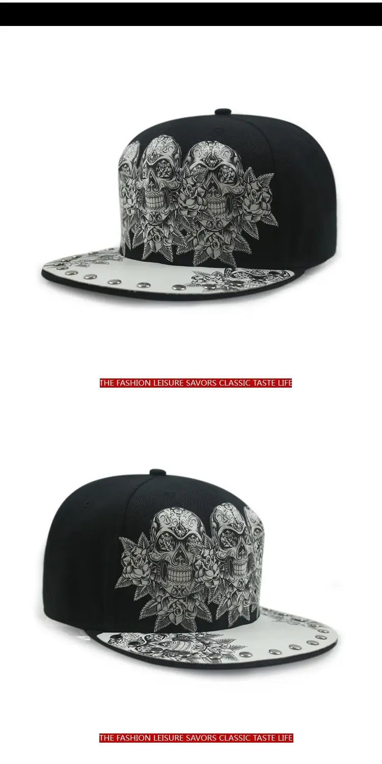 Black snapback baseball cap featuring intricate white sugar skull and floral embroidery with silver rivets along the brim.
