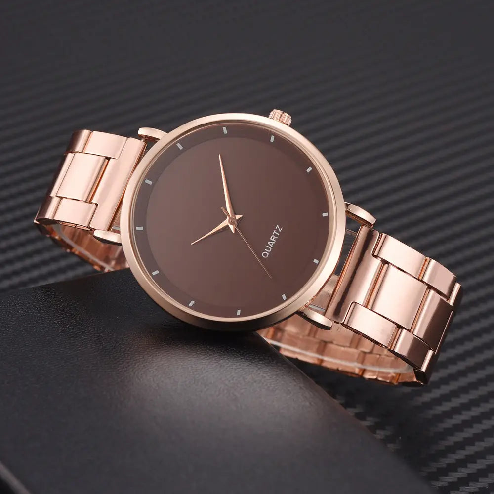 Rose gold women luxury quartz wristwatch with a sleek minimalist design featuring a dark brown dial and matching metal bracelet for business use.