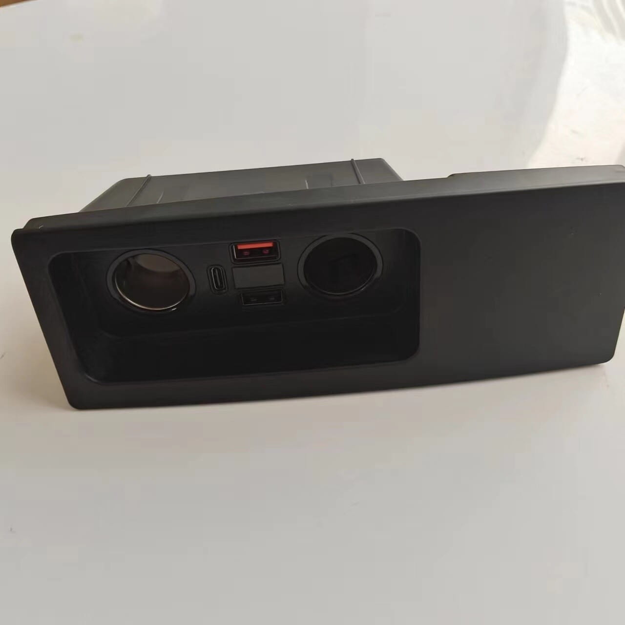 black plastic car center console storage compartment with two circular cup holders and usb port designed for audi a6 c7 rs6 s7 rs7 wireless car charger pad.