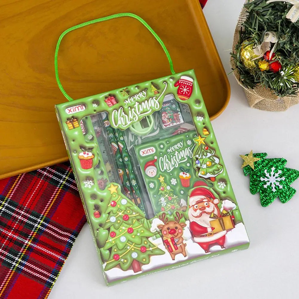space theme cartoon kids stationery set featuring green christmas-themed packaging with santa, reindeer, and trees printed on it.